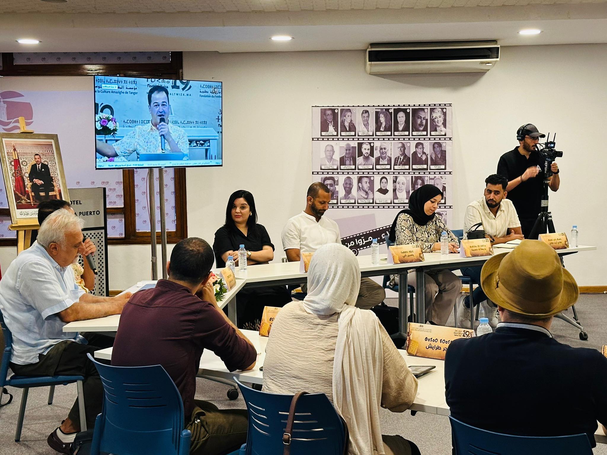 May be an image of 11 people, people studying, table and text
