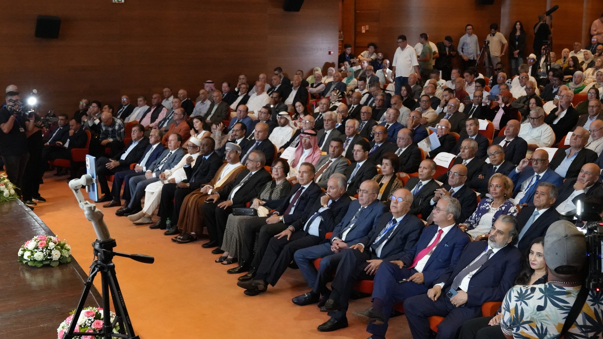May be an image of 1 person, crowd and dais