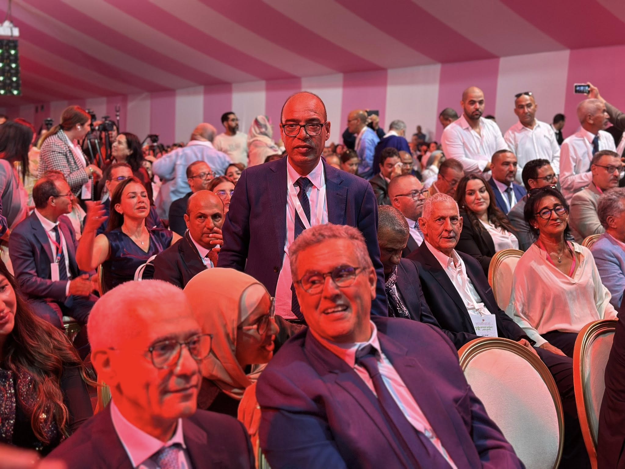 May be an image of one or more people, crowd and dais